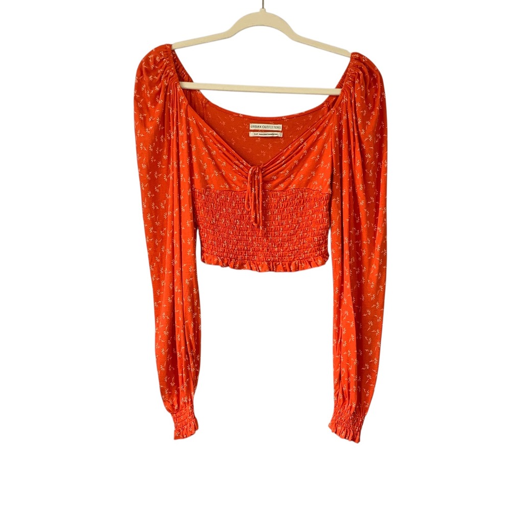 Urban Outfitters burnt orange long sleeve crop top with white flowers. Size Sm-P